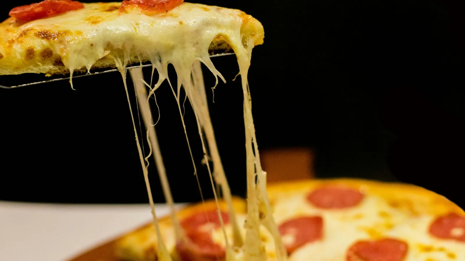 Close up of a delicious wood-fired pizza with fresh basil